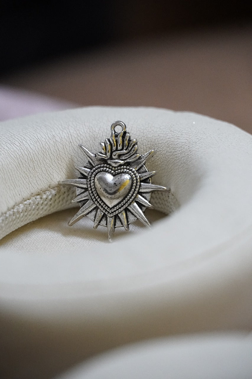 Flaming sacred heart pendant