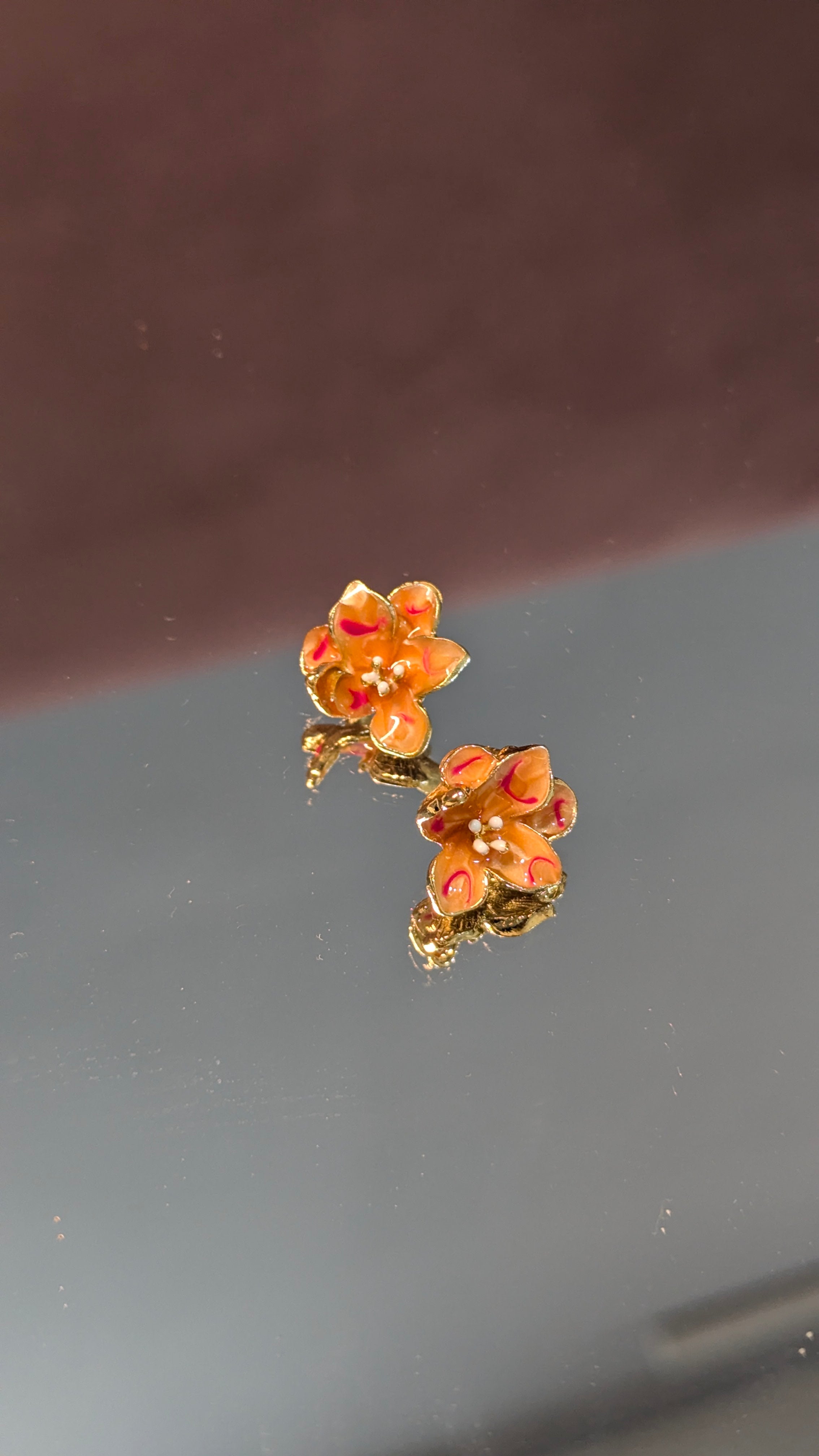 Orange flower stud earrings