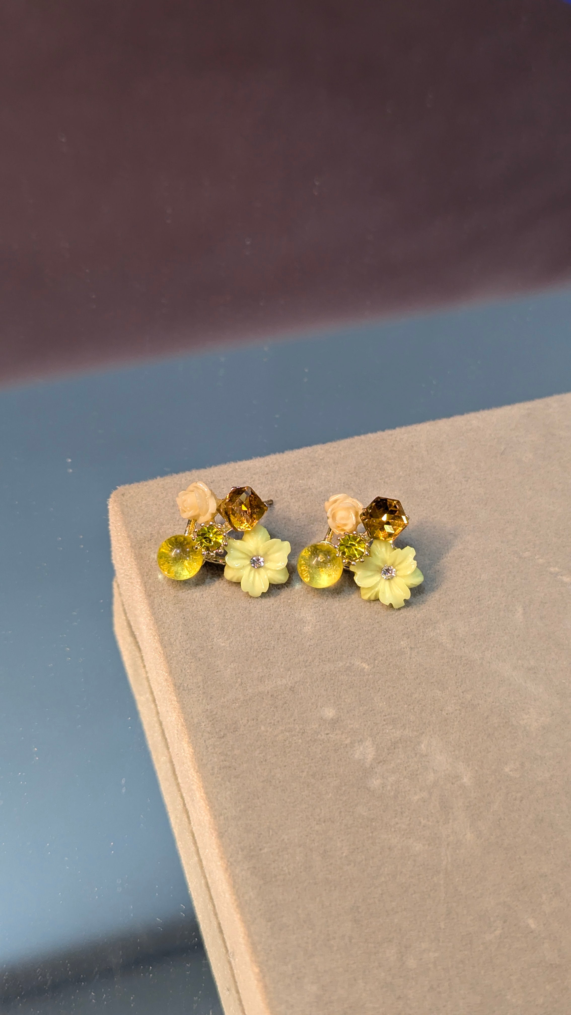 Yellow floral stud earrings