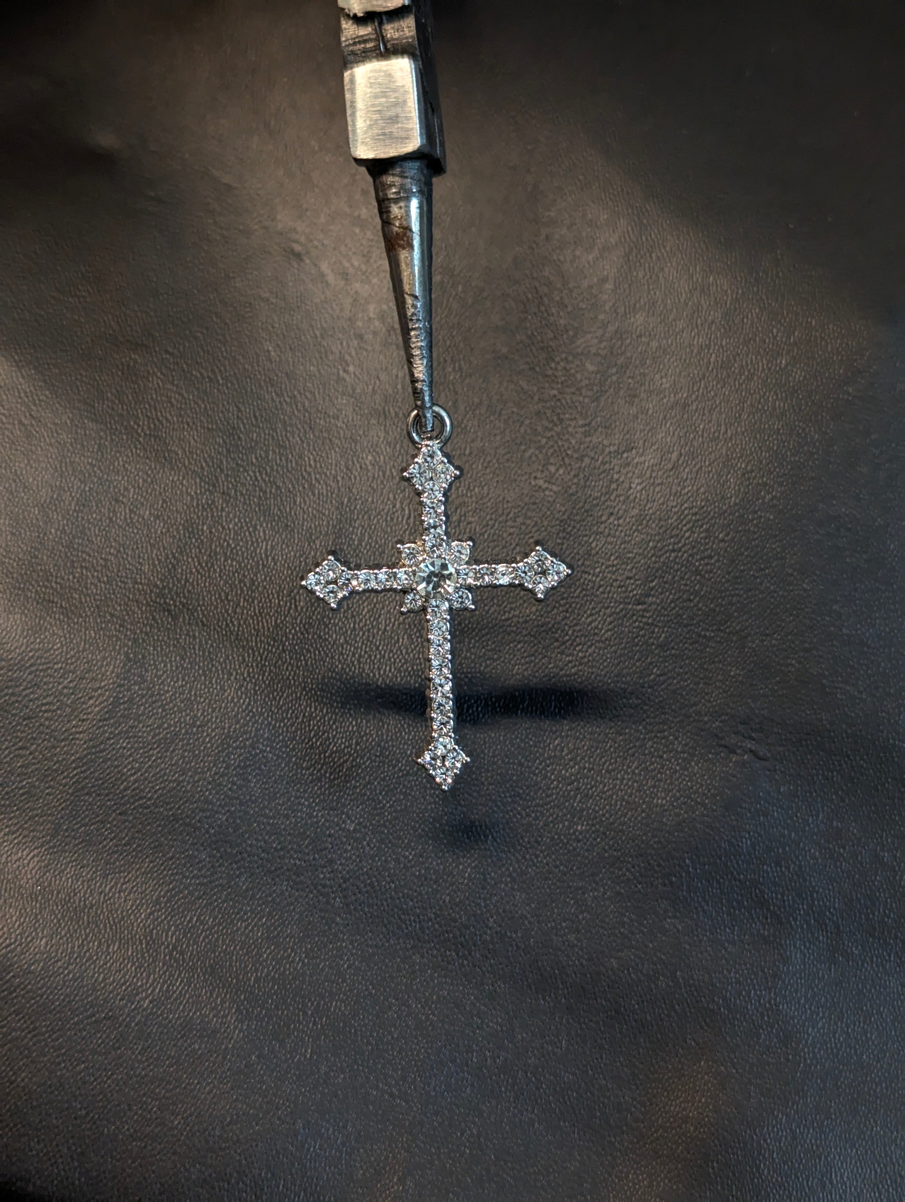 White stone cross pendant