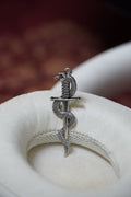 Snake and sword pendant